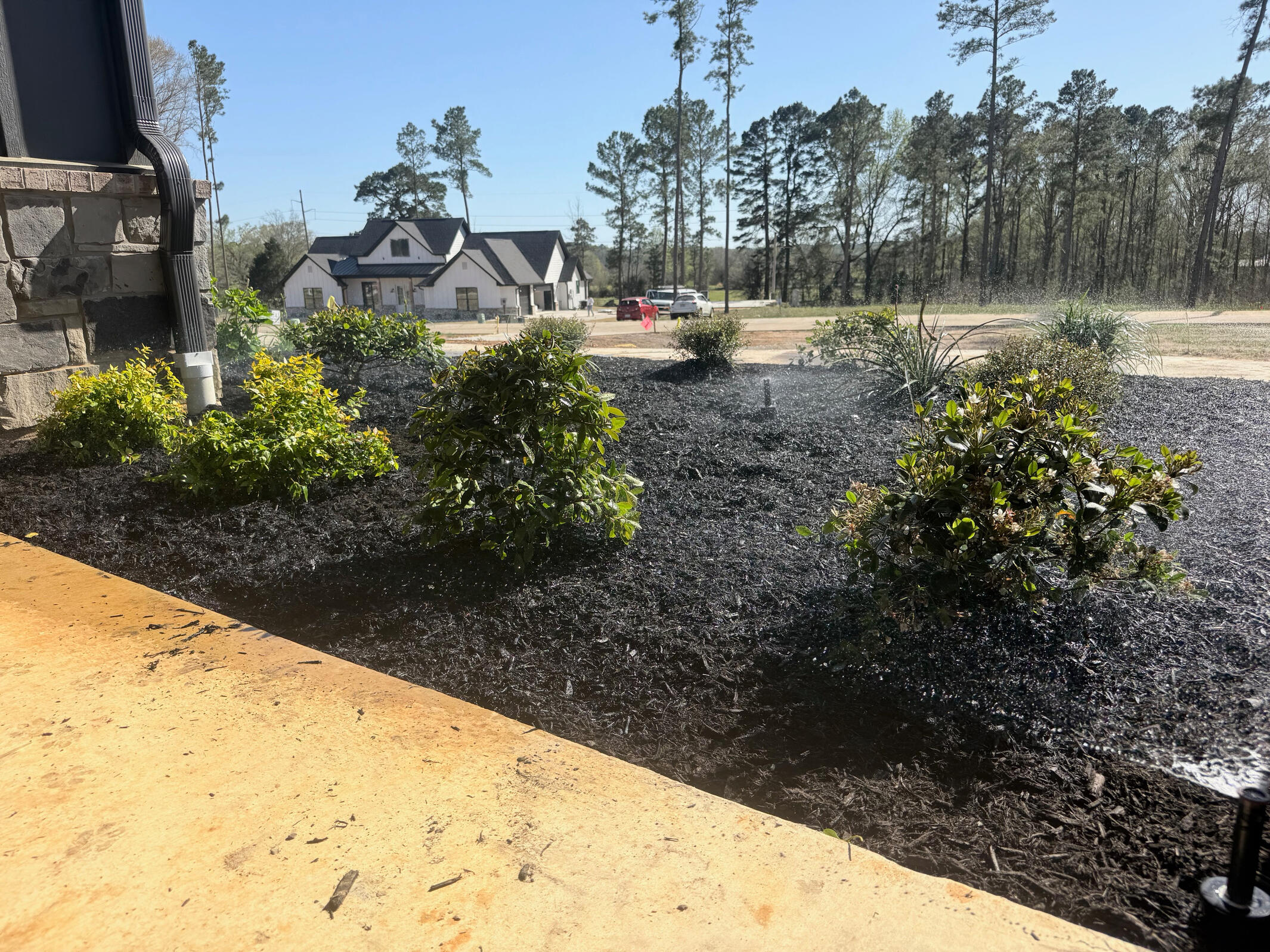 Above-ground water pump system installed near neighborhood utilities in Gladewater, Texas. Professional irrigation and pump solutions built for East Texas properties.